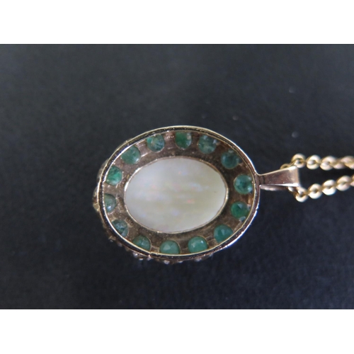 959 - A 9ct opal pendant on a 9ct gold chain - Length 45cm - total weight approx 7 grams