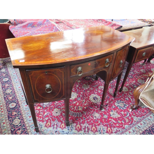 277 - A Georgian mahogany and cross banded bow fronted sideboard with three drawers on six square tapering... 