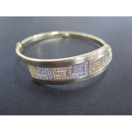 772 - A 14ct yellow gold bangle - approx weight 13.5 grams - Width 6.5cm x 6cm - marked AVORT TSE 585 - cl... 