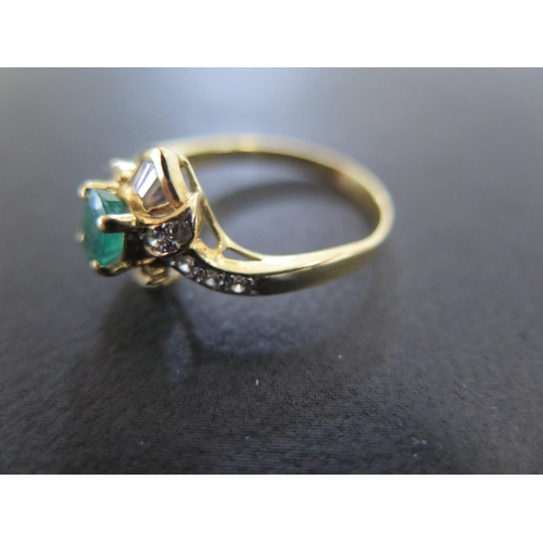 836 - An 18ct yellow gold emerald and baguette cut diamond ring size Q - approx weight 3.7 grams - light u... 