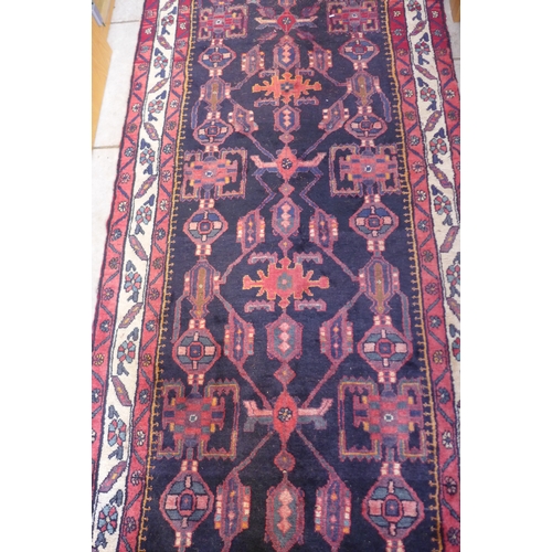 403 - A hand knotted woolen Hamadan runner - 3.50m x 1.17m