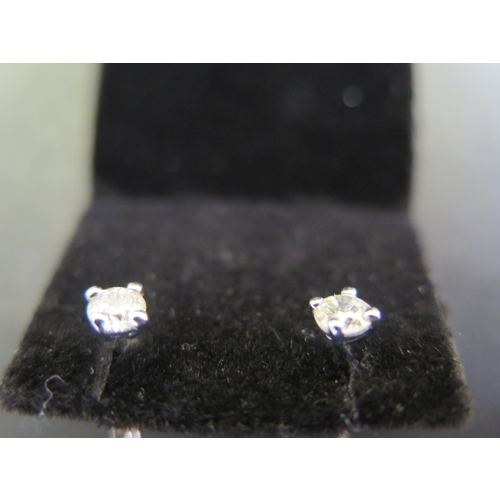 804 - A pair of 9ct white gold diamond stud earrings - total approx diamond weight 0.50ct - total weight a... 