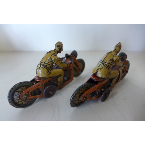 1151 - Two small tinplate clock work motorcycles 9cm long and two Dinky race cars - some play wear to all, ... 