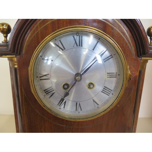 418 - A mahogany case 8 day mantle clock, strikes hours and half