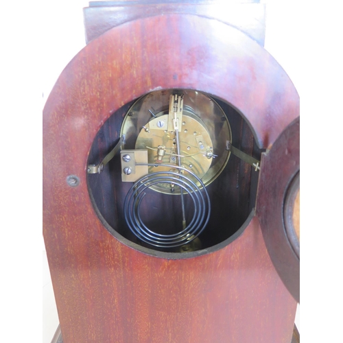 418 - A mahogany case 8 day mantle clock, strikes hours and half