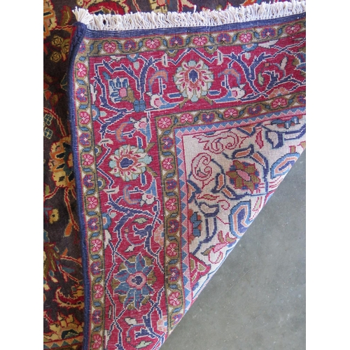 476 - A red ground Kashmir and rug, approximately 214 cm x 132 cm, in good condition