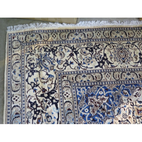 468 - A hand knotted woollen Fine Nain rug - 388cm x 291cm