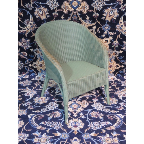 91 - A green Lloyd Loom chair, some wear but sturdy