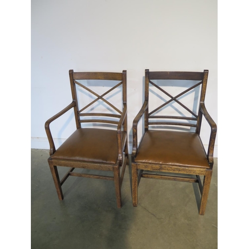 213 - A pair of oak Georgian style carver chairs