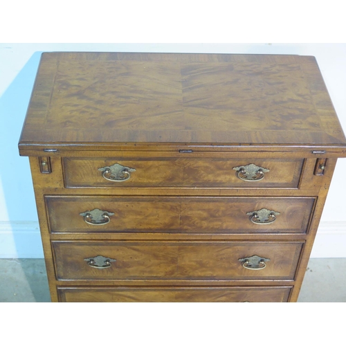 242 - A Georgian style walnut bachelors chest with a fold over top, above four drawers, on bracket feet, m... 