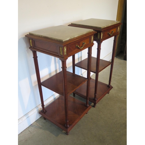 240 - A pair of walnut marble topped three tier stands with a frieze drawer and ormulu mounts 91cm tall, 4... 