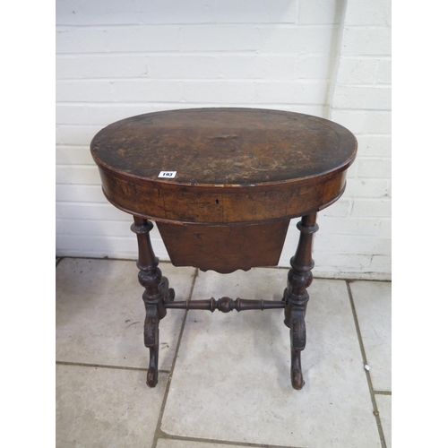 241 - A Victorian walnut work box with an oval top, turned columns and carved supports, interior void need... 