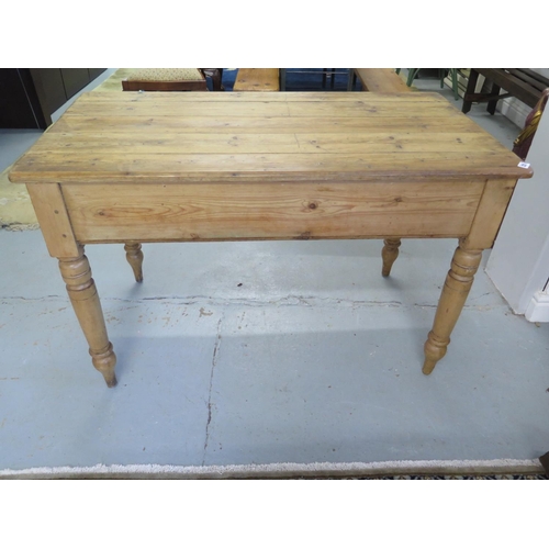 215 - A Victorian stripped and waxed pine kitchen table on turned legs - 76cm x 119.5cm x 63.5cm