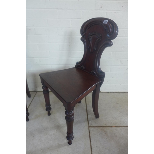 235 - A pair of 19th Century mahogany hall chairs, both in clean condition