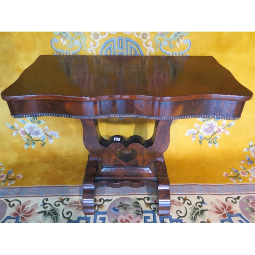 238 - A circa 1810 mahogany side table with top leaf on pivot for storage compartment, with Egyptian motif... 