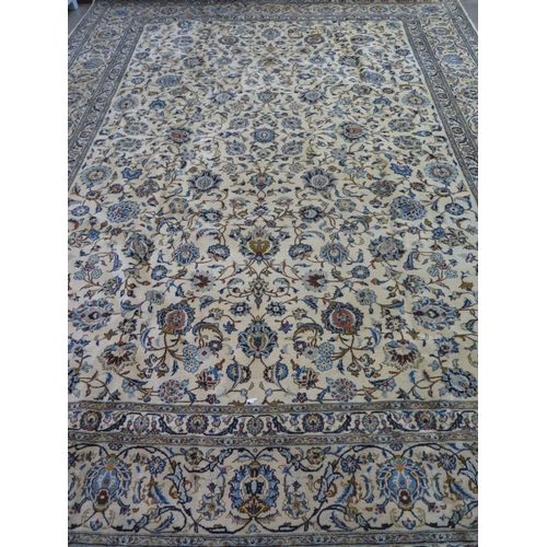 478 - A hand knotted woollen Fine Kashan rug - 420cm x 308cm