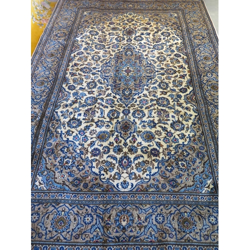 486 - A hand knotted woollen kashan rug, with caucasian ground, approx. 293cm x 194cm, in good condition