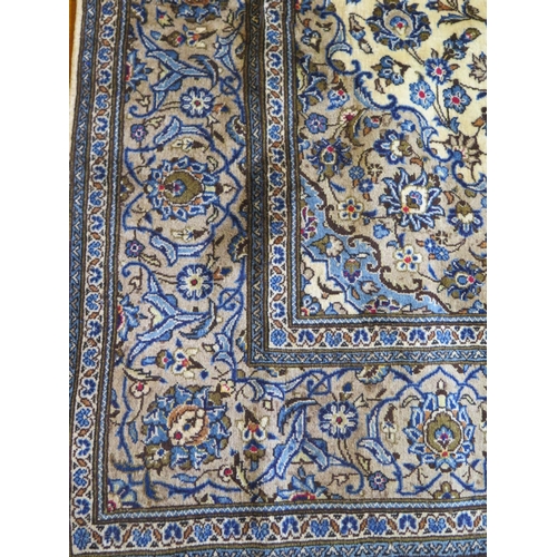 486 - A hand knotted woollen kashan rug, with caucasian ground, approx. 293cm x 194cm, in good condition