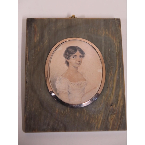 533 - An early 19th Century portrait miniature of a lady wearing a white dress, watercolour and pencil on ... 