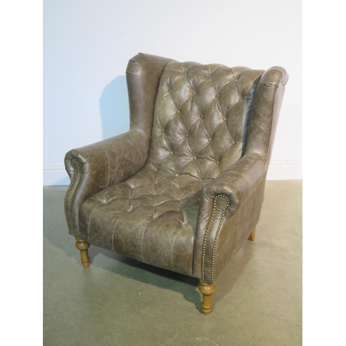 117 - An Alexander & James leather button back armchair as new, ex-display - RRP £1500