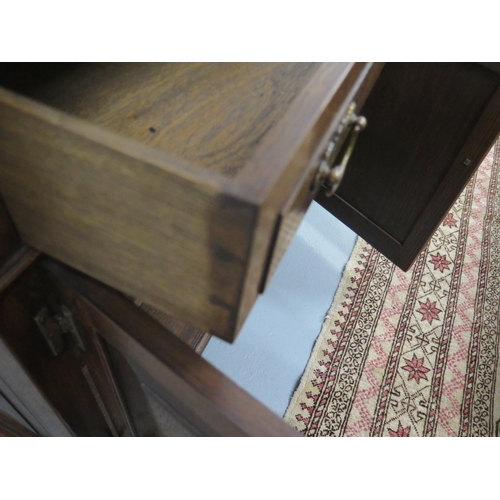 15 - A good quality Georgian style oak dresser by Simon Simpson of Norwich with an open rack top above th... 