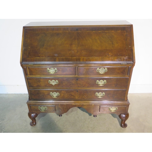 155 - A good quality early 20th Century Georgian style mahogany bureau with a fitted interior, above two s... 