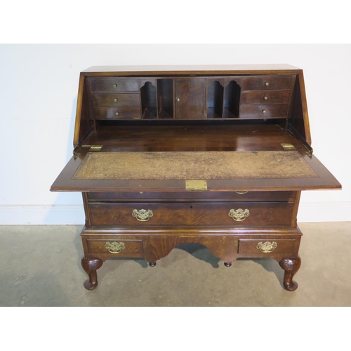 155 - A good quality early 20th Century Georgian style mahogany bureau with a fitted interior, above two s... 