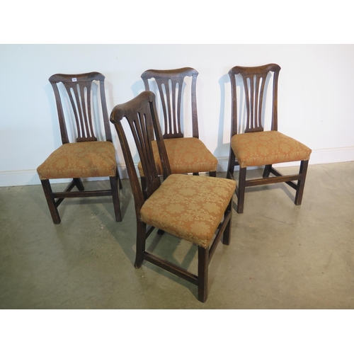 157 - A set of four Georgian oak dining chairs, with overstuffed seats