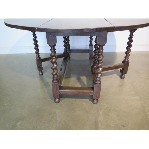 161 - A good quality 18th Century style oak drop leaf dining table on barley sugar supports, 78cm tall, 15... 