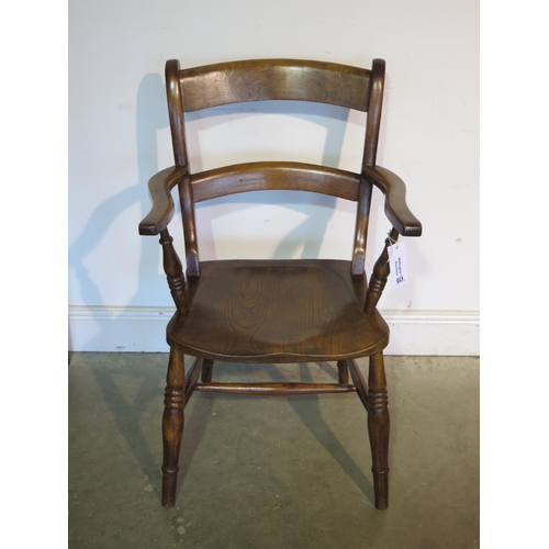 173 - A 19th Century elm arm chair, good colour and patina