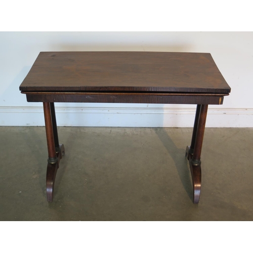 181 - A 19th Century rosewood card table, with twin pillar supports and arched feet, 92cm wide, 45cm deep,... 