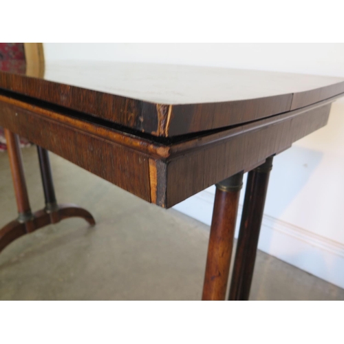 181 - A 19th Century rosewood card table, with twin pillar supports and arched feet, 92cm wide, 45cm deep,... 