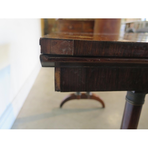 181 - A 19th Century rosewood card table, with twin pillar supports and arched feet, 92cm wide, 45cm deep,... 