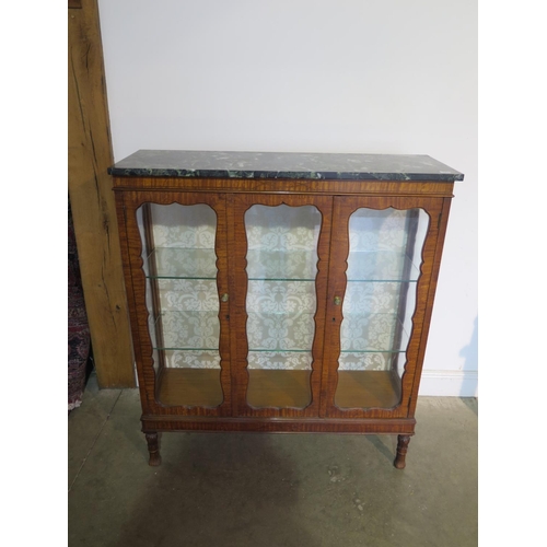 183 - A 19th Century style satinwood marble top display cabinet with two doors and two glass shelves, 122c... 