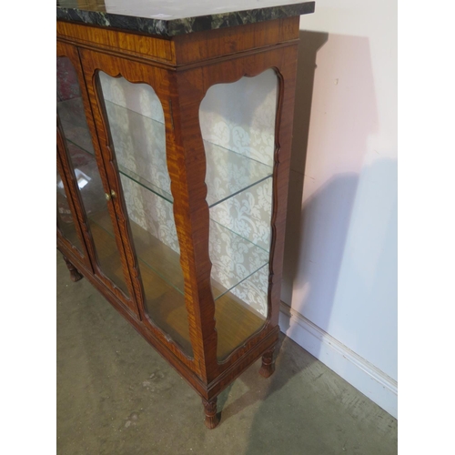 183 - A 19th Century style satinwood marble top display cabinet with two doors and two glass shelves, 122c... 