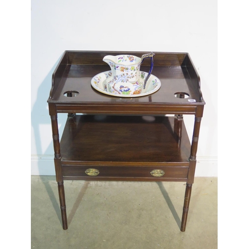 185 - A 19th Century mahogany wash stand with a Masons ironstone bowl and jug above base, drawer on ring t... 