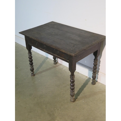 192 - A 17th/18th Century oak side table on turned supports with a single drawer, with good colour, in nee... 