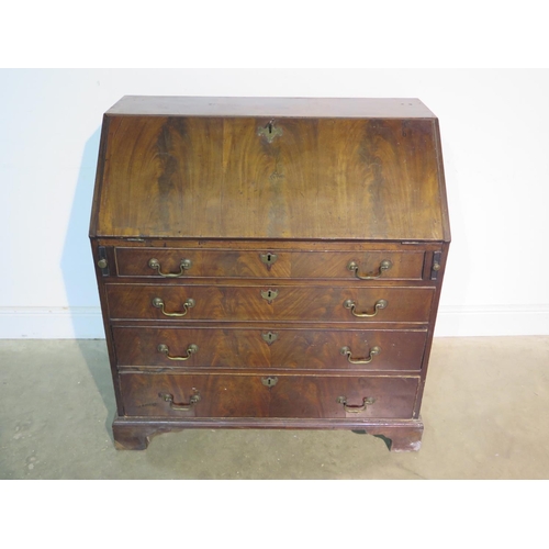 194 - A Georgian mahogany bureau with a fitted interior over four long graduating drawers on bracket feet,... 