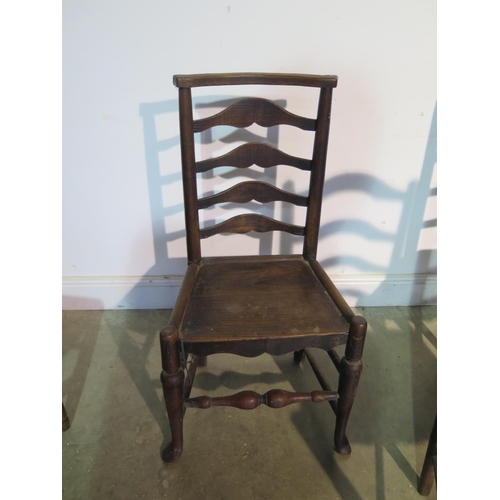 196 - Seven 19th Century ladder back chairs all with solid seats to include three matching, a pair and two... 