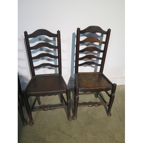 196 - Seven 19th Century ladder back chairs all with solid seats to include three matching, a pair and two... 