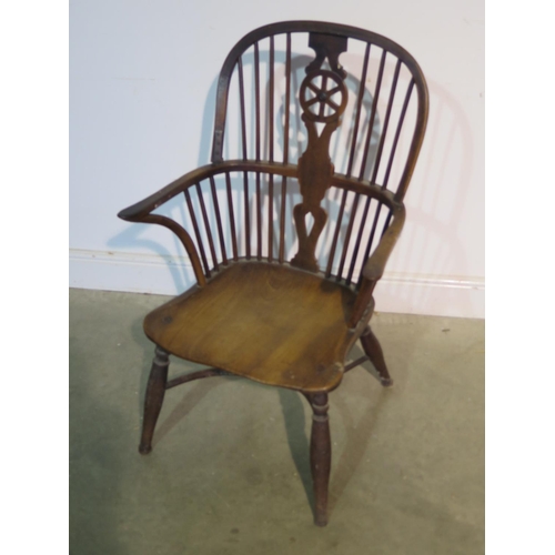 198 - A 19th Century elm and yew wood wheel back armchair, with a crinoline stretcher - 97cm H, seat heigh... 