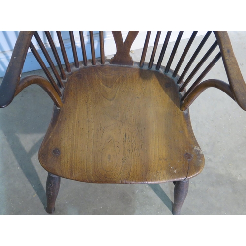 198 - A 19th Century elm and yew wood wheel back armchair, with a crinoline stretcher - 97cm H, seat heigh... 