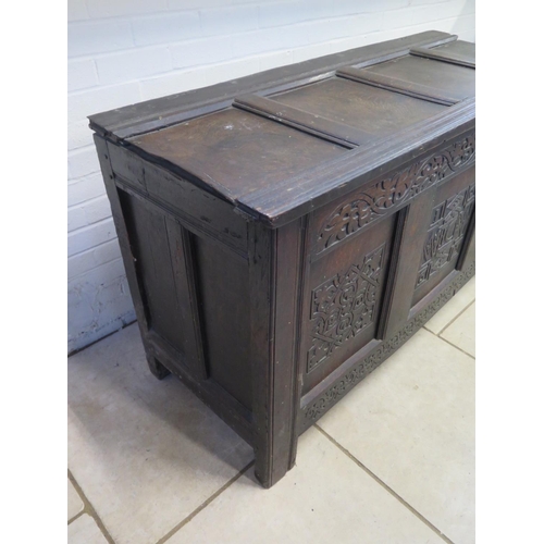 199 - A 17th Century carved oak coffer, with a three panel front, dated 1663 - 87cm H x 149cm x 59cm - wit... 