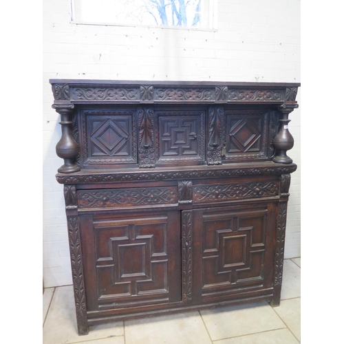 200 - An 18th/19th Century carved oak two section court cupboard with a three door top above a two drawer,... 