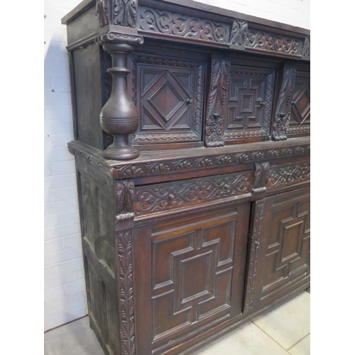 200 - An 18th/19th Century carved oak two section court cupboard with a three door top above a two drawer,... 