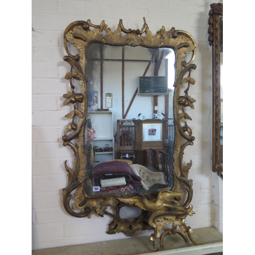 203 - A Georgian gilt phoenix wall mirror with leaf and berry and acanthus decoration, 130cm H x 66cm W, i... 