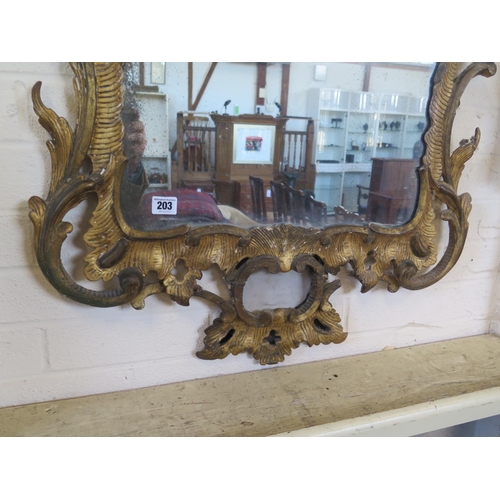 203 - A Georgian gilt phoenix wall mirror with leaf and berry and acanthus decoration, 130cm H x 66cm W, i... 