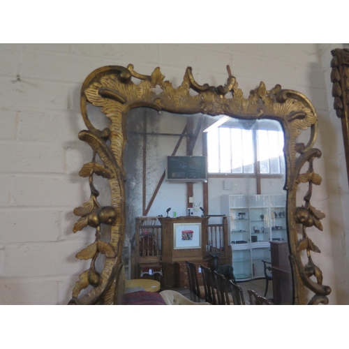 203 - A Georgian gilt phoenix wall mirror with leaf and berry and acanthus decoration, 130cm H x 66cm W, i... 