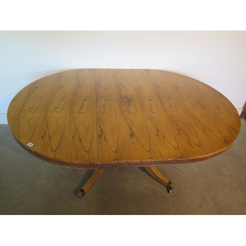 205 - A bespoke rosewood dining table made in the style of William Trotter, on a quatrefoil base, the top ... 