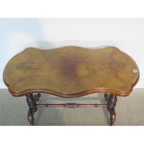 222 - A 19th Century walnut side table with a shaped top on a base with turned carved legs, top damaged wi... 